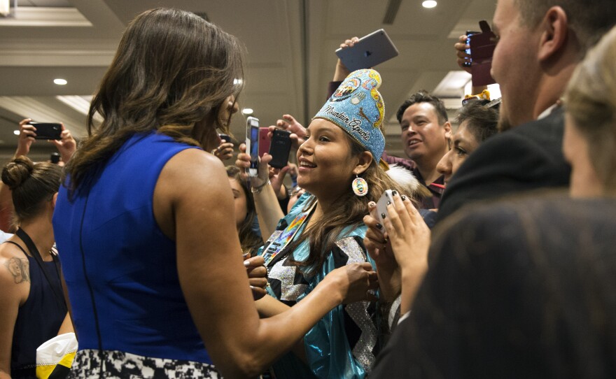 Obama embraces Deandra Antonio, 17, of Whiteriver, Ariz., after her speech.