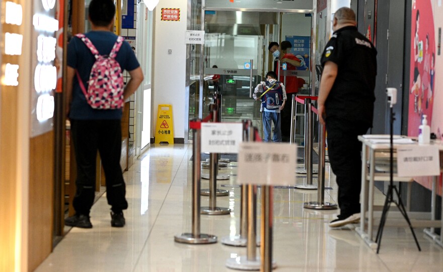 A student enters a private after-school session in Beijing's Haidian district.