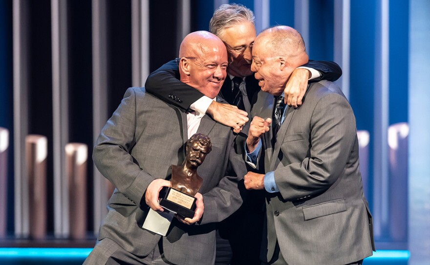 Founder of the Fealgood Foundation John Feal, Air Force Master Sgt. veteran Israel del Toro and Jon Stewart, 2022 Mark Twain Prize, The Kennedy Center, Washington, D.C.