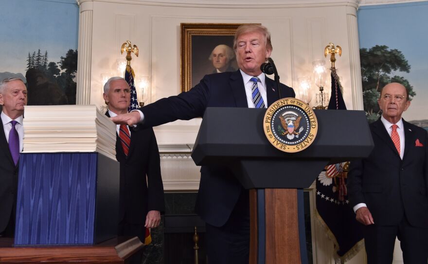 President Trump speaks about the recently passed spending bill at the White House on Friday. Trump threatened to veto the bill before later signing it.