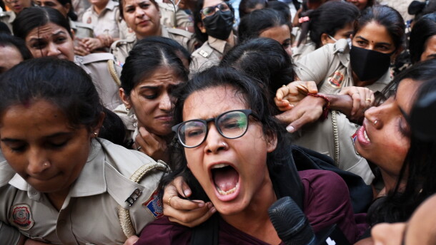Prominent student leader Neha Bora, center, shouts slogans as she is detained by the police during a youth demonstration demanding the resignation of the country's election chief Gyanesh Kumar, in New Delhi, India, Friday, Oct. 16, 2026.