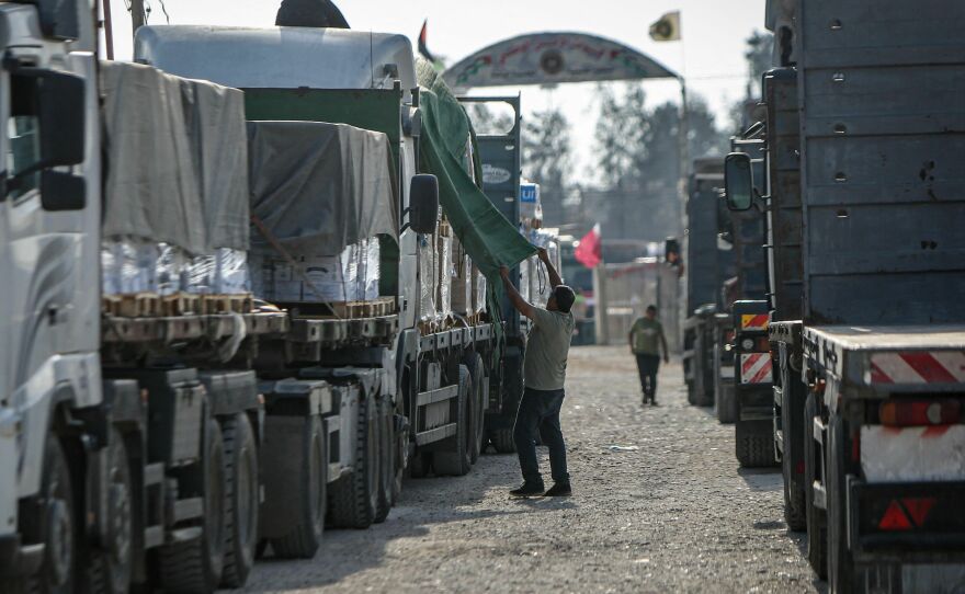 A convoy of trucks carrying humanitarian aid enters the Gaza Strip from Egypt via the Rafah border crossing on Oct. 21.
