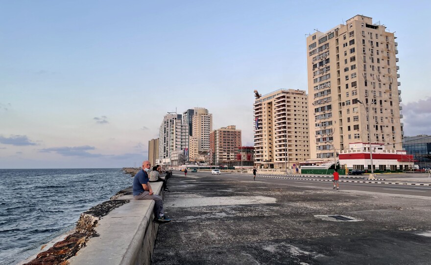The iconic Malecón stretches along Havana's shoreline, with waves often crashing over it. The promenade, usually bustling with visitors and residents, awaits the return of more tourists.
