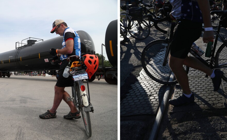 Left: Riders wait for a train to pass through West Bend, Iowa, so they can continue their 56-mile ride Tuesday, July 26, on Day 3 of RAGBRAI. Right: Riders carefully cross train tracks in downtown Whittemore on Wednesday, July 27, on Day 4.