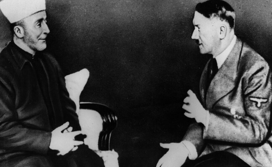 Adolf Hitler talking to Grand Mufti Haj Amin al-Husseini. Israeli Prime Minister Benjamin Netanyahu has attracted criticism after suggesting al-Husseini convinced Hitler to carry out mass genocide against Jews.