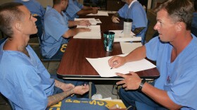 Inmates in Donovan state prison take turns drawing each other, Sept. 2015.