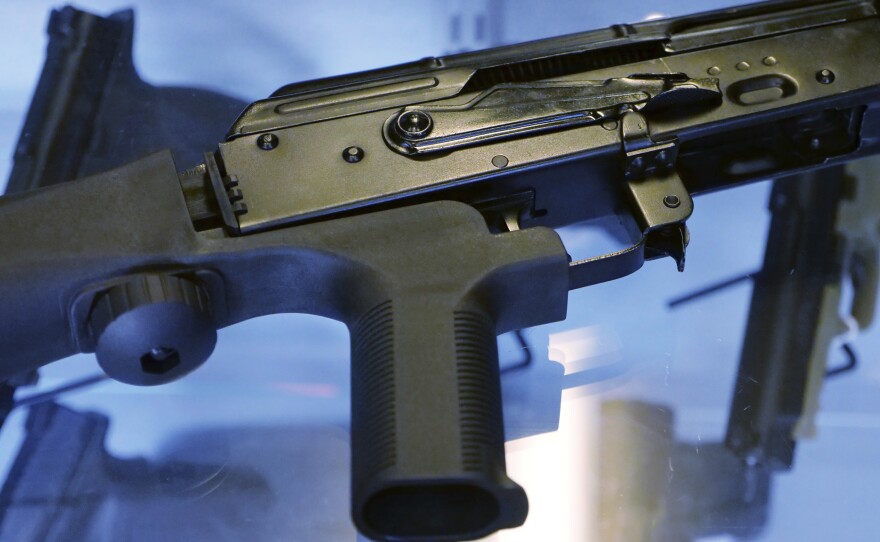 The Trump administration is moving to ban bump stocks, like the one attached to the rifle above, which allow semiautomatic weapons to fire rapidly.