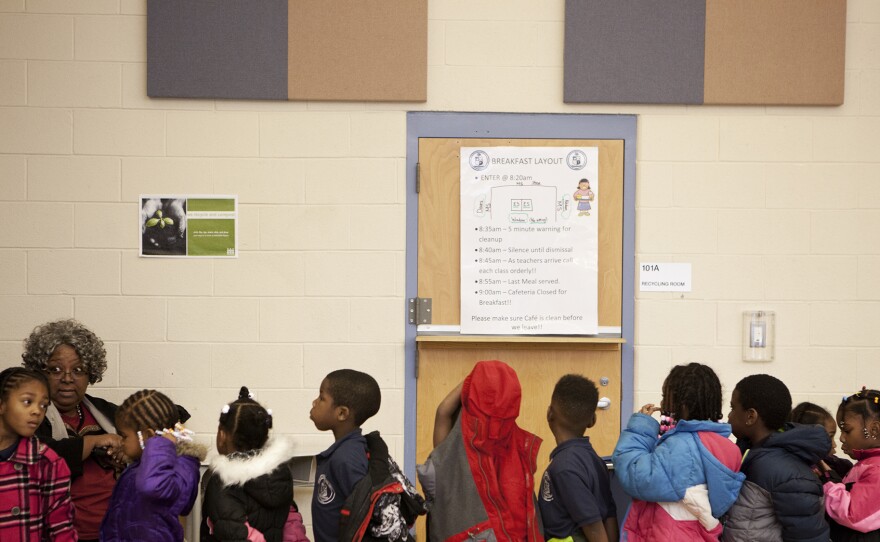 Kids line up to leave the lunch room at Walker-Jones.