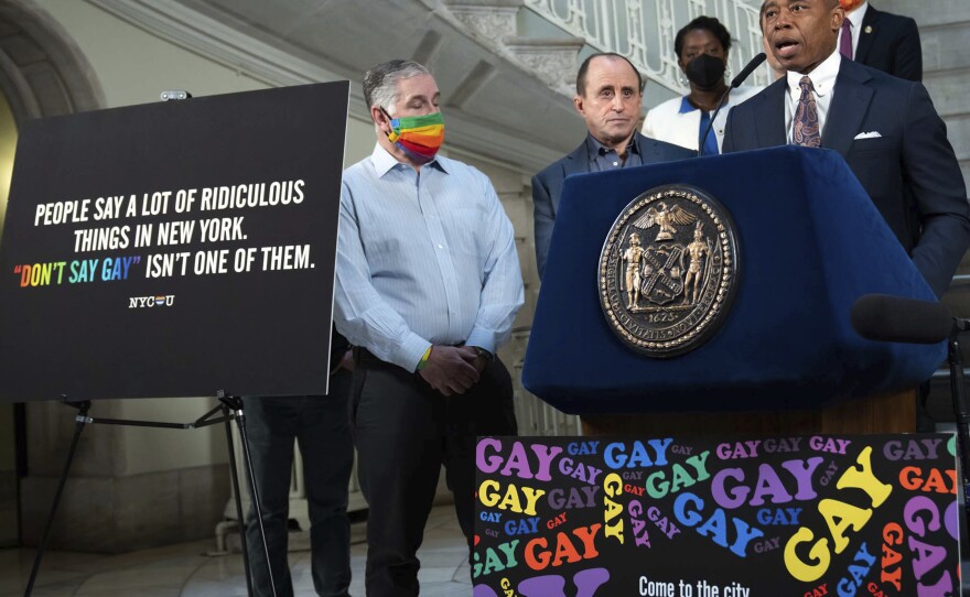 New York Mayor Eric Adams, at podium, addresses a news conference in the rotunda of City Hall, in New York, on April 4. New York City is launching a digital billboard campaign, supporting LGBTQ visibility that will be displayed in five major markets in Florida for eight weeks, to lure Floridians unhappy with their state's "Don't Say Gay" law to the Big Apple, Adams announced.