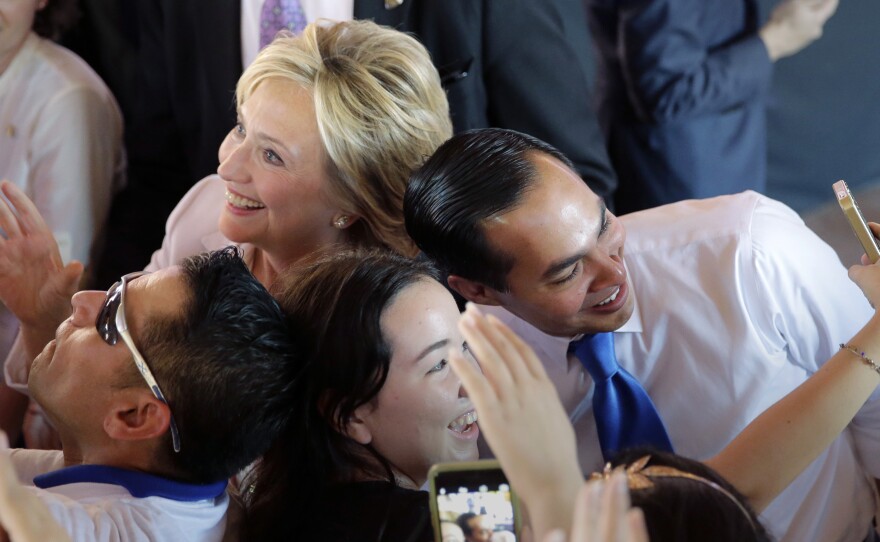 Hillary Rodham Clinton and Julian Castro, secretary of the Department of Housing and Urban Development, pose for photos with supporters in October in San Antonio.