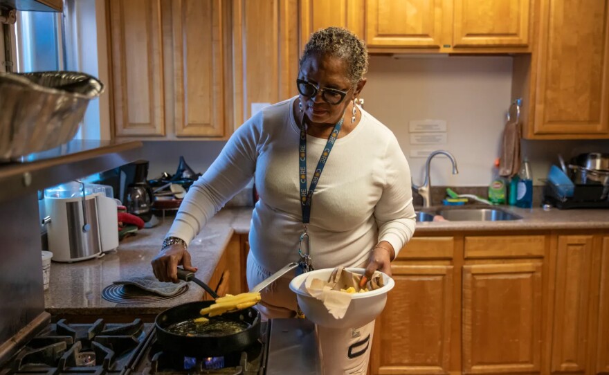 Norma Johnson cooks in the communal kitchen at the Closer to Home St. Mary’s Center transitional housing in West Oakland on Jan. 12, 2023.
