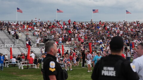 Law enforcement secure the area as people evacuate because of incoming storms that will delay the program at a Salute to America Independence Day event honoring the nation's 250th anniversary, Saturday, July 4, 2026, on the National Mall in Washington.