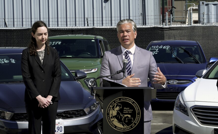 California Attorney General Rob Bonta, right, discusses the surge in thefts of Kia and Hyundai vehicles at a news conference on Thursday, April 20, 2023, in Berkeley, Calif.