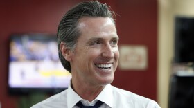  Democratic Lt. Gov. Gavin Newsom smiles at a campaign stop at Stakely's Barber Salon in Los Angeles, May 31, 2018. 