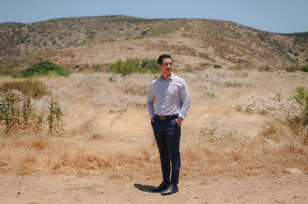 Chula Vista resident Juan Escorcia stands for a portrait in the San Miguel neighborhood, where he lives, on June 25, 2024. Escorcia works as a real estate agent in Chula Vista and thinks residents should be more involved in preparing for wildfires.