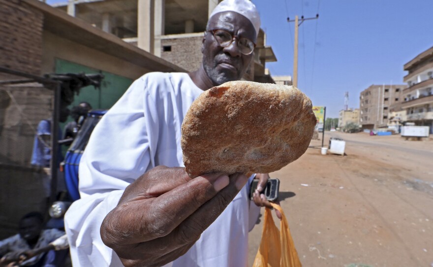 Sudanese buy bread from a bakery in Khartoum on Oct. 11, 2021. The country has suffered from shortages of wheat and other essentials due to the closure of Port Sudan during protests.