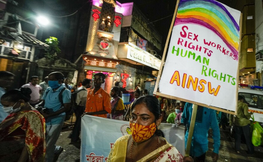 Sex workers and activists walk in a rally demanding right of work in government labor rules on the eve of May Day in Kolkata, India.
