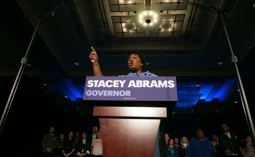 Stacey Abrams addresses her supporters at an election watch party early Wednesday in Atlanta. She and her opponent, Republican Brian Kemp, are locked in a gubernatorial race that remains too close to call.