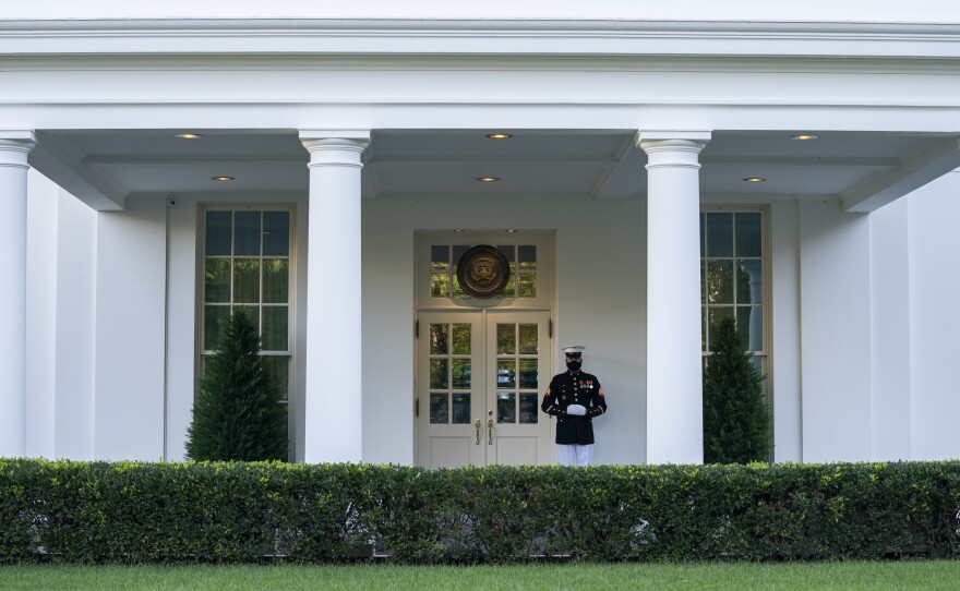 A Marine is posted outside the West Wing of the White House on Thursday, signifying the President is in the Oval Office. Trump's physician said that he could return to public engagements as soon as Saturday.
