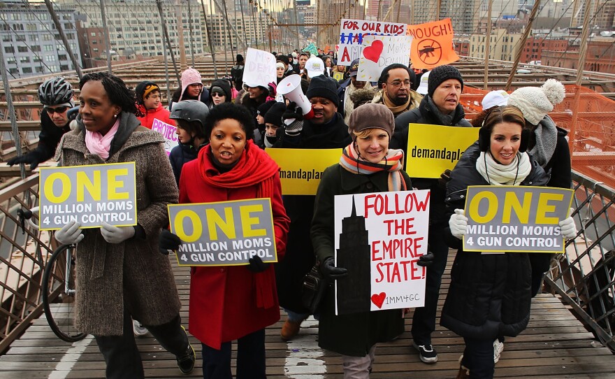 Participants with One Million Moms for Gun Control, a gun control group formed in the wake of the mass shooting at a Newtown, Conn., elementary school, hold a rally and march across the Brooklyn Bridge in New York City in January 2013.
