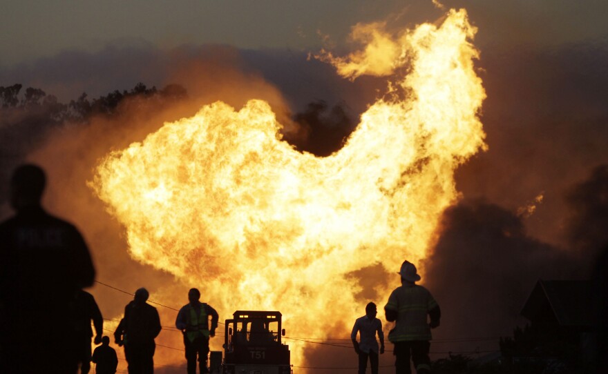 A massive fire roars through a neighborhood in San Bruno, Calif., after a PG&E gas pipeline ruptured, killing eight people, in 2010.