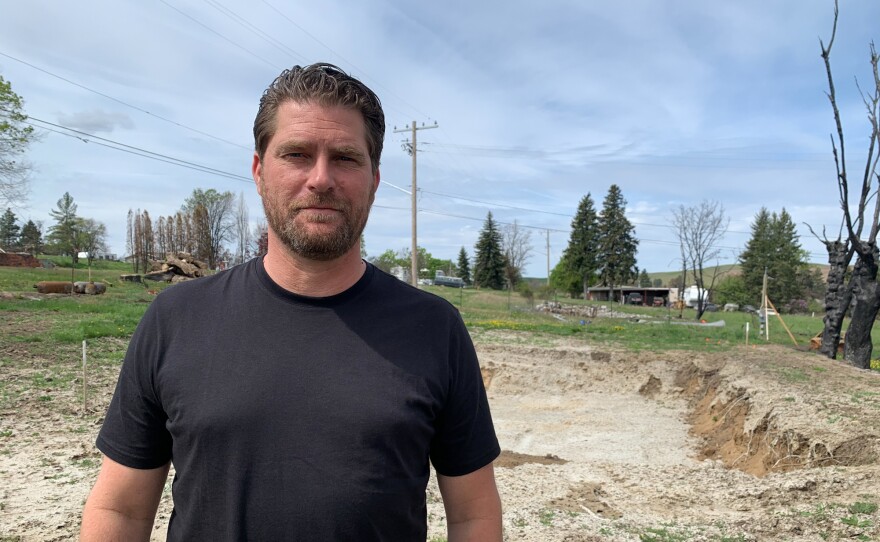 Scott Hokonson stands at the site of where his home used to be in Malden Wash. A wildfire on Labor Day of 2020 destroyed 80% of the small farming town.