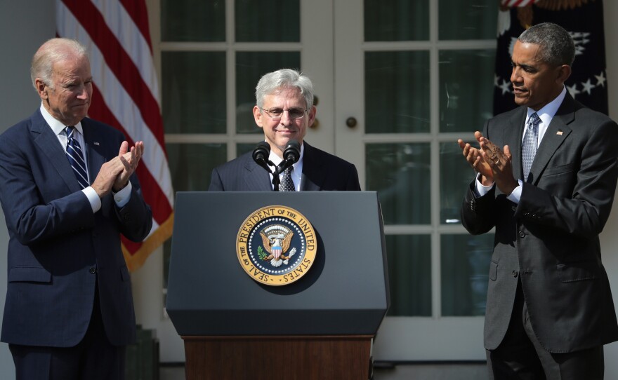 President Obama and Vice President Biden stand with Judge Merrick B. Garland as he is nominated to the U.S. Supreme Court on Wednesday at the White House Rose Garden.
