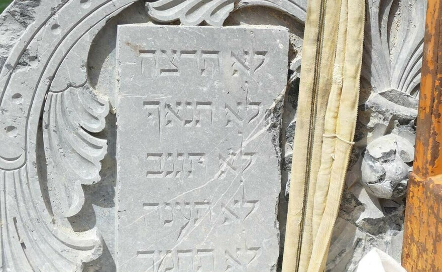 Fragments of the synagogue's marble Torah shrine at the discovery site of the rubble in the Isar river in Munich.