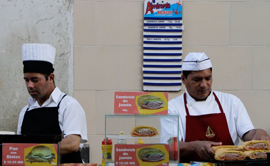 Workers prepare sandwiches at a snack bar in Havana. Many Cubans are excited at the prospect of having more of a say in the workplace, but others are worried about higher crime and unanswered questions about the new economic landscape.