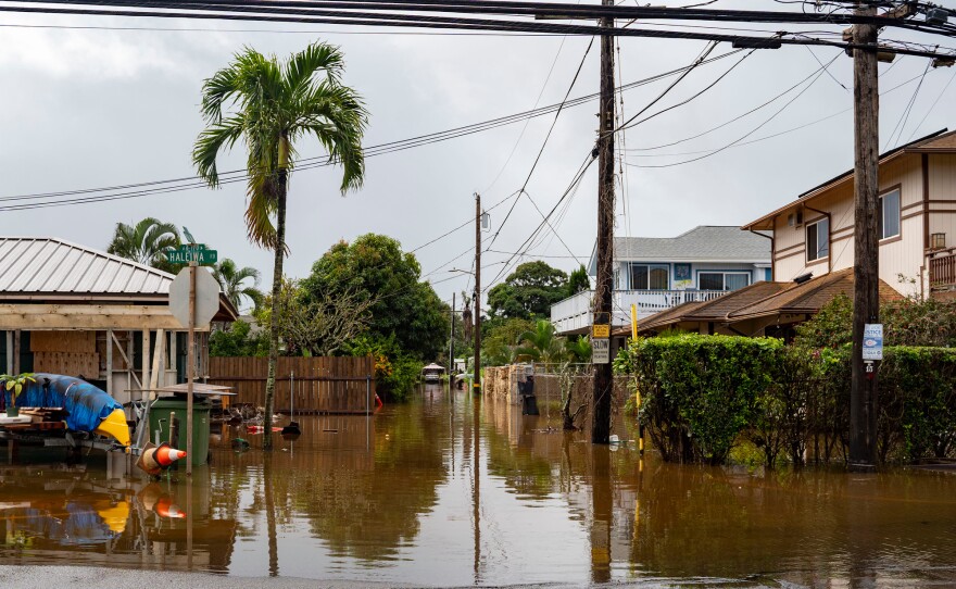 Streets are flooded from severe rains Friday in Haleiwa, Hawaii.