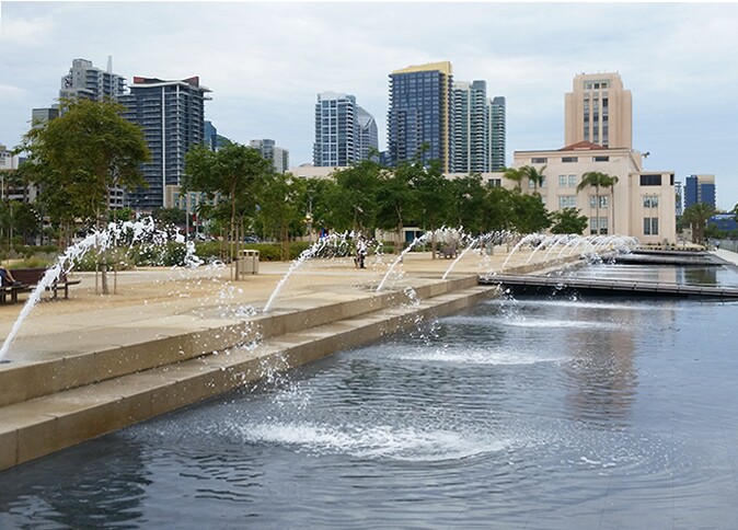 A series of water spouts splash into the San Diego County Water Park on the north side of the County Administration Building in downtown San Diego, June 27, 2015.