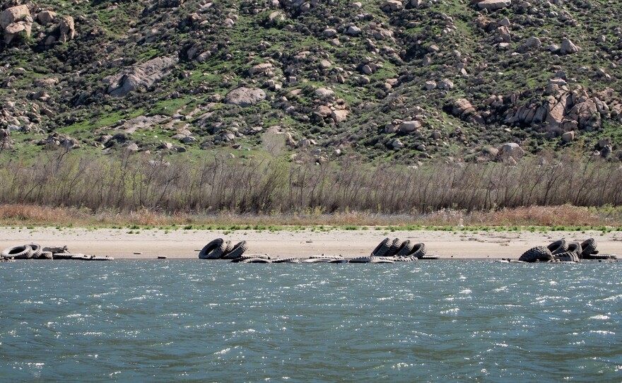 Last fall, the drought revealed dozens of large tractor tires that had been submerged under the water of Lake Perris. The "tire reef" had been placed under the water in the 1970s as a fish habitat.