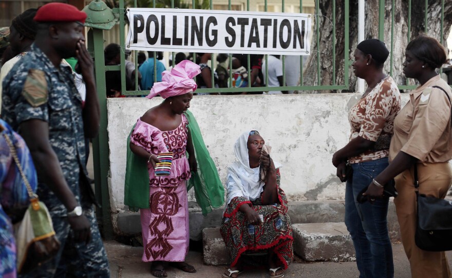 Gambians wait to cast votes at a polling station Thursday in Banjul.