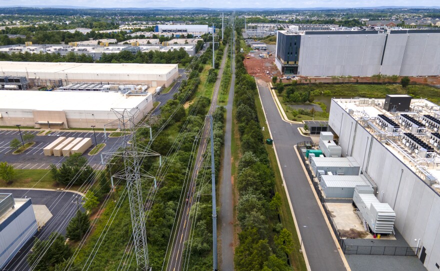 High-voltage transmission lines provide electricity to data centers in Ashburn, Virginia. Globally, data centers' demand for electricity is expected to roughly double by 2030.