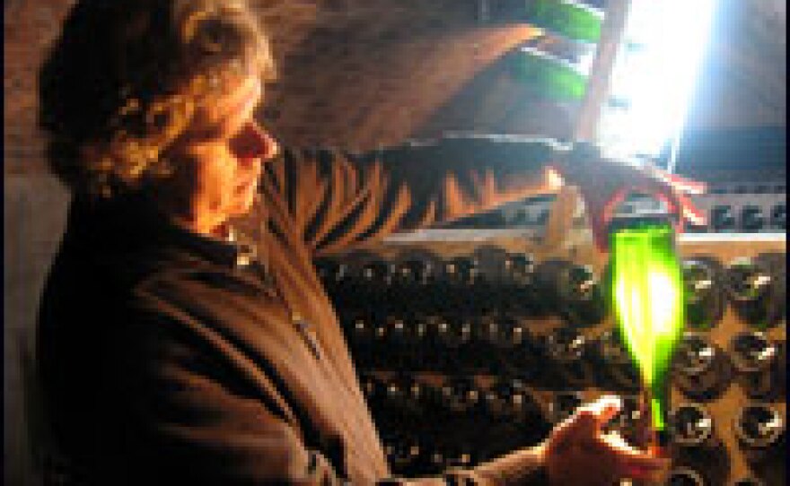 Jaume Gramona checks a bottle of one of his best vintages in the cellar of his winery in Sant Sadurni d'Anoia, the capital of "cava," a sparkling wine.