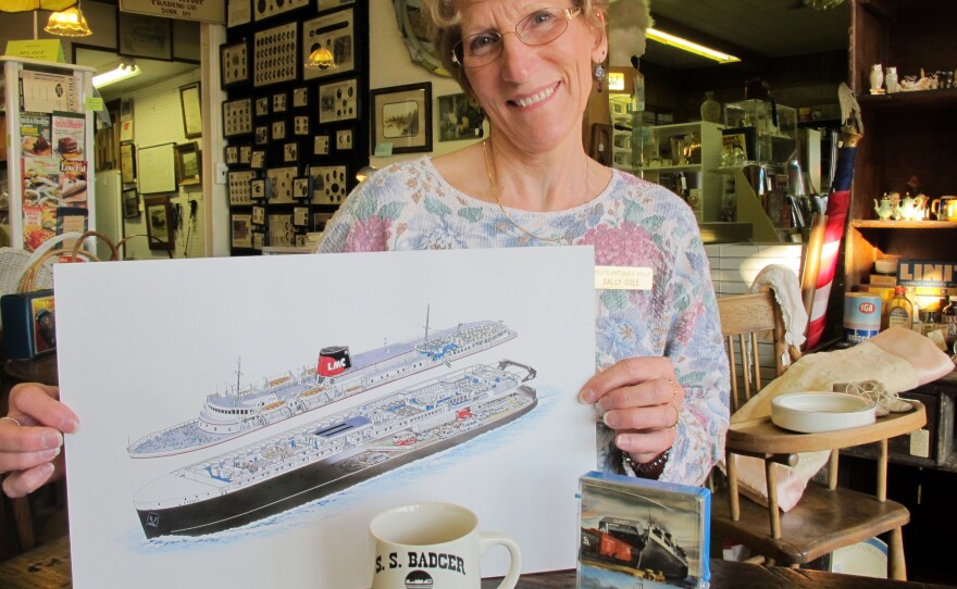 Sally Cole, co-owner of Cole's Antiques Villa in Ludington, Mich., displays some of the shop's memorabilia from the S.S. Badger.