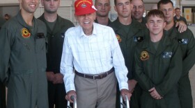 Former Marine Pvt. Frank Baron Jr. stands with Marines assigned to Marine Aircraft Group 39 during a tour of the air station at Camp Pendleton, Calif., Dec. 11, 2012. Baron served as an active duty Marine from 1933 to 1937. 