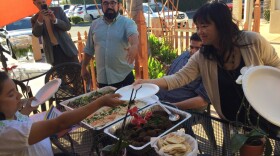 Santa Ana high school cultural ethnics and history teacher Ben Vazquez, 45, invites guests on the food tour in Little Arabia to try some of Kareem's Restaurant hummus, salad and baba ganoush.