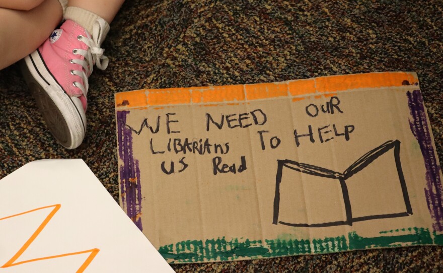 A child's handmade sign sits on the floor during the San Marcos Unified School District's board meeting on Thursday, Feb. 26, 2026.