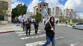 Members of the Teamsters Union Local 2010 are shown walking a picket line at San Diego State University on February 17, 2026.