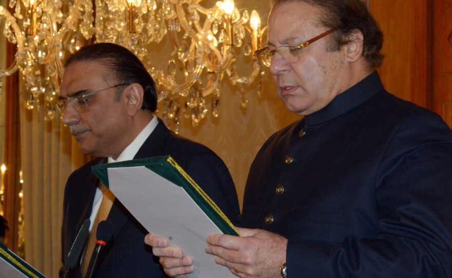 Newly elected Pakistani Prime Minister Nawaz Sharif (right)  during a swearing in ceremony at the Presidential Palace in Islamabad on Wednesday. Sharif has vowed to end U.S. drone strikes in the country.