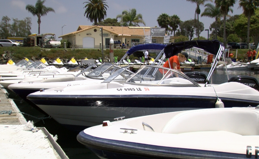 An employee prepares a boat at Seaforth Boat Rentals in Mission Bay, June 30, 2017.