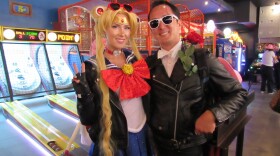 From left: Cherish and Valor McConnell dress as biker Sailor Moon and Tuxedo Mask at Coin-Op for the "Dungeon Crawler Carl" activation on July 26, 2025. 