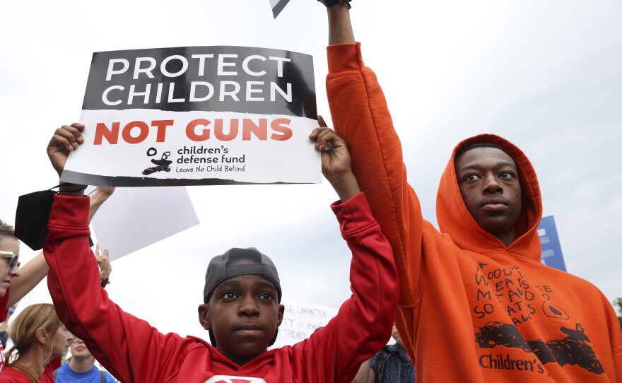 Demonstrators attend a March for Our Lives rally against gun violence on the National Mall in Washington, D.C.
