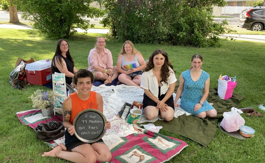 Dani Marietti (holding sign) and her friends gather for a "sterilization shower" in Helena, Montana, in July before Marietti was scheduled to have her fallopian tubes surgically removed.