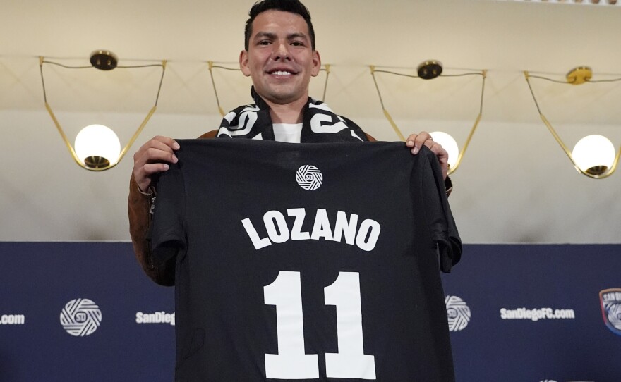 Hirving "Chucky" Lozano poses with his new San Diego FC jersey during an introductory news conference for the new MLS soccer team Thursday, June 13, 2024, in San Diego.