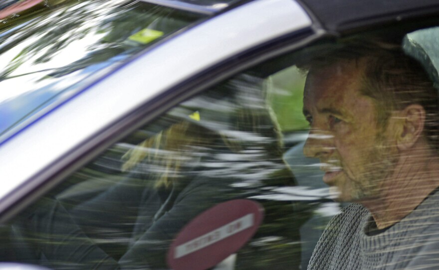 Phil Rudd, the drummer for rock band AC/DC, leaves a court house in Tauranga, New Zealand, on Thursday.