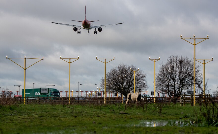 An airplane arrives at London's Heathrow Airport on Thursday — the same day a court blocked plans for a third runway at the airport, citing the government's climate change commitments.