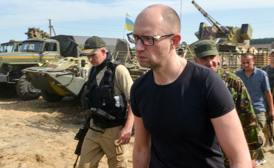Ukrainian Prime Minister Arseniy Yatsenyuk visits forces stationed near the small city of Izyum on Wednesday
