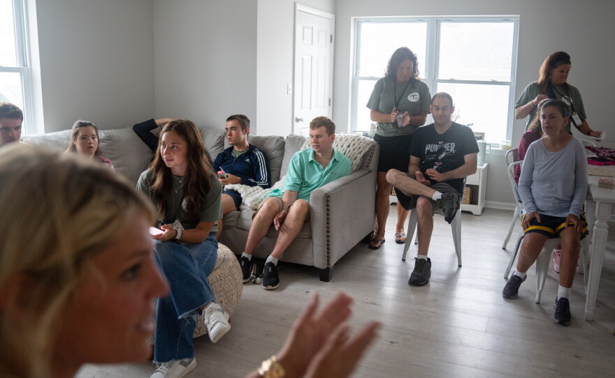 At Next Steps, each day begins with a community meeting led by Executive Director Jen Dyer. Everyone in the group shares what they've been up to outside the program.